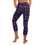 Thumbnail: Back view of a lady dressed in flowered yoga capri leggings leggings taking a step