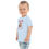 Thumbnail: Left view of a toddler looking sideways and wearing a light blue puppy cheer Christmas T-shirt on sale online