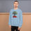 Thumbnail: Front view of a man wearing a light blue motivational unisex sweatshirt designed with Biblical inscription