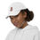 Thumbnail: Left-side view of a girl wearing a white embroidered Santa Claus cap for sale online at gracefultshirts.com