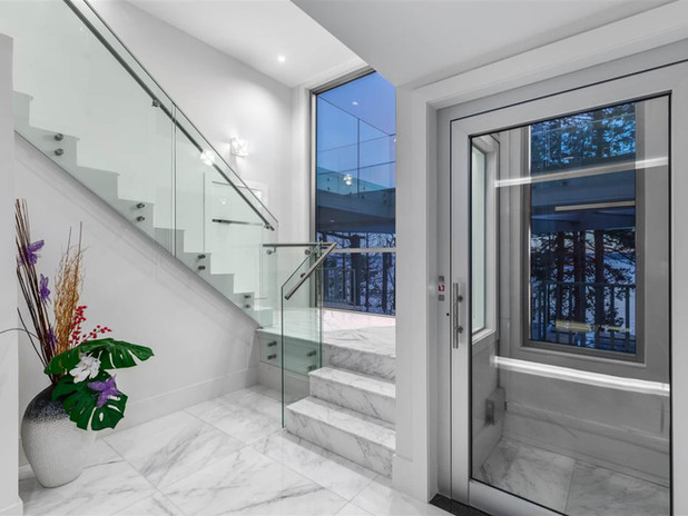 An edgy, stunning new home boasts a three-storey glass elevator