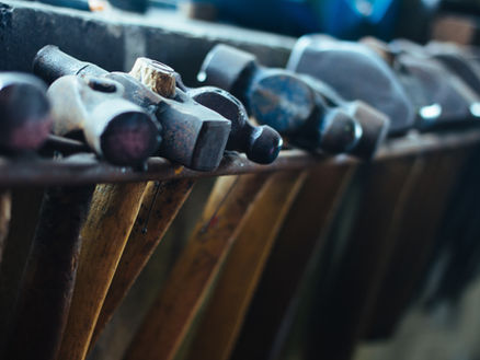 A collection of hammers of varying size, type and weight