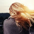 Woman pondering at sunset