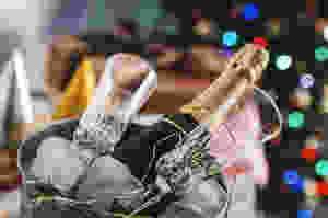 Bottle of champagne and two glasses in an ice bucket