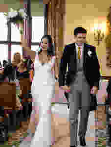 Happy bride and groom walking down the aisle after their celebrant wedding ceremony