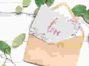 Open envelope with a card with the word Love