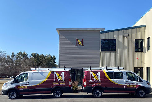 Murphy Electric vans with wrapped decals and colors.