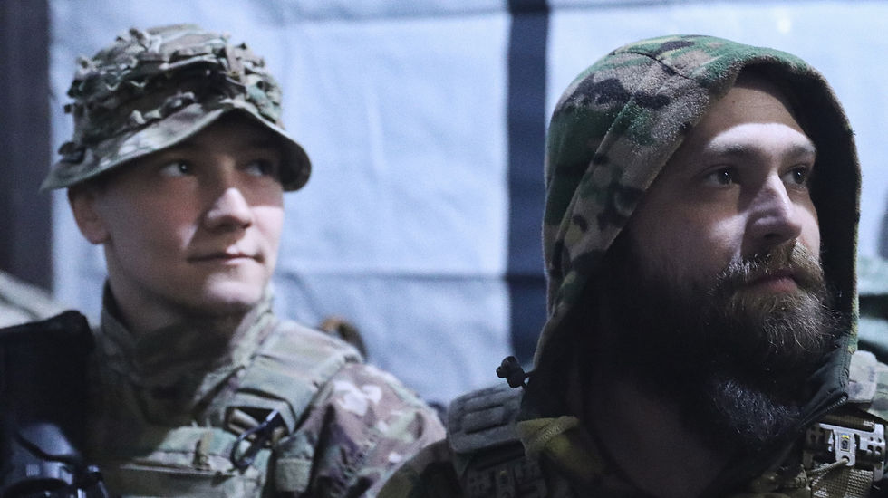 “Serpen” and “Khor”, soldiers of the Khartia Brigade, in a house used for rotations outside Kharkiv, April 2026.