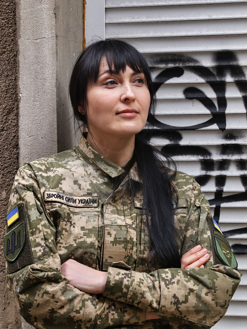 Mavka, a communications officer with Ukraine’s 72nd Mechanized Brigade, the Black Cossacks, photographed in central Kharkiv. April 2026.