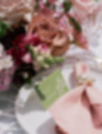Green place cards with calligraphy in white