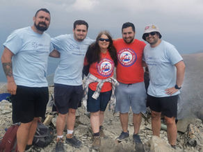Luke with his family at the top of Ben Nevis