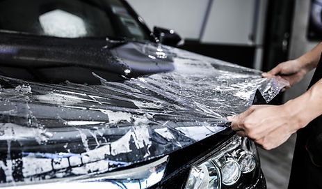 close-up-paint-protection-film-installation-front-bumper-modern-luxury-car-ppf-is-polyuret