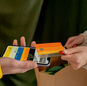 A close-up of a contactless payment using a credit card and smartphone, highlighting modern technology.
