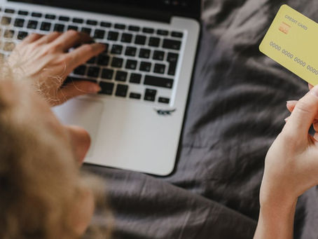 Build credit after repossession - person reviewing personal finances at home