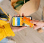 Person making contactless payment with a credit card using smartphone. Online shopping and delivery concept.