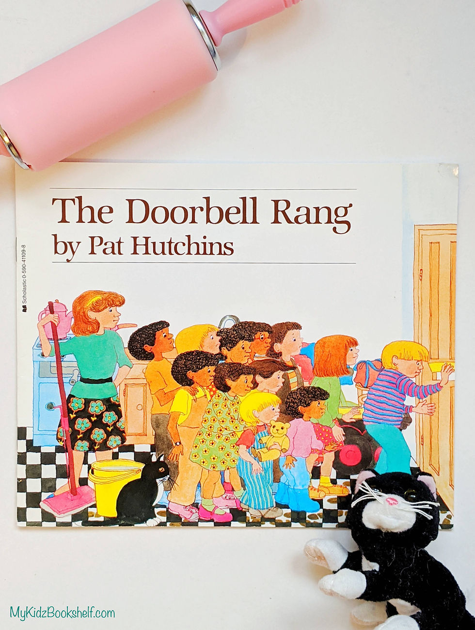 The Doorbell Rang by Pat Hutchins book cover shows kids and Ma in kitchen going to door with cat looking on