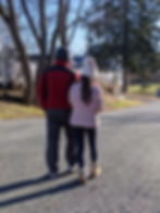 Father and daughter walking on the street