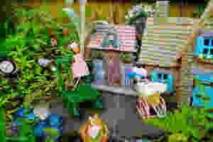 Fairy garden cottages, rocking chair, clock and little fairy charms