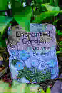 Fairy garden stone sign that reads, Enchanted Garden, Do You Believe?