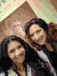 mother-and-daughter-posing-in-front-of-a-poster-from-the-Crown-exhibit-in-Winterthur