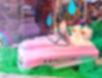 Easter pink toy car with chicks in window display at G. Willikers toy store Saratoga, New York