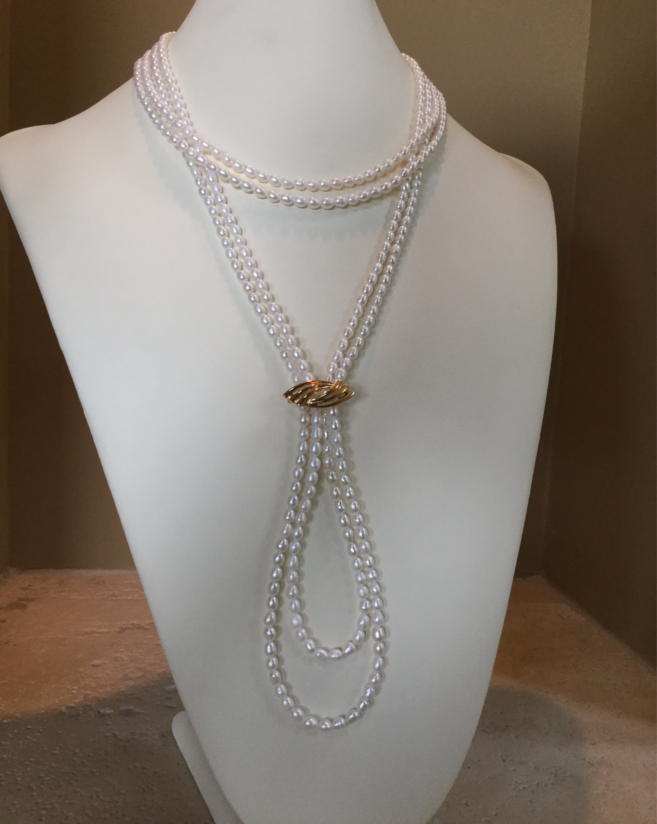 necklace: 4 strands of cultured rice pearl