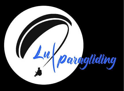 luxparagliding logo bleu sur pavé noir.png