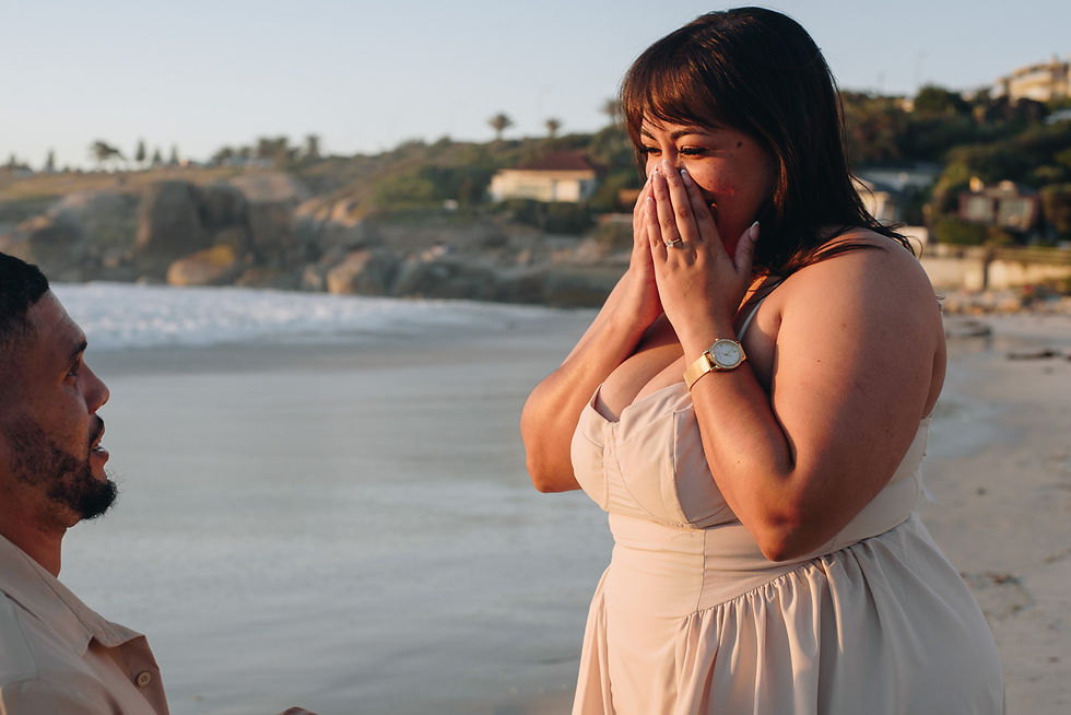Cape Town proposal photographer capturing a proposal at sunset on a beach in Cape Town. 