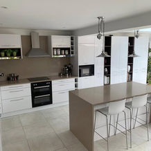 modern, tidy kitchen with quartz worktops and table