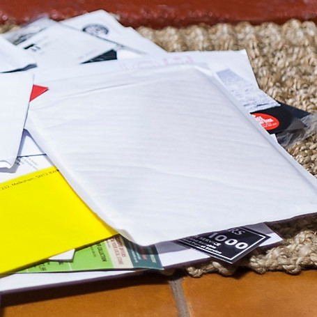 Pile of mail on doormat