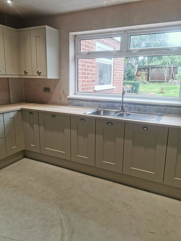 A modern kitchen with white cabinets