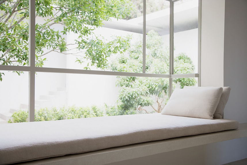 Tinted windows in a house overlooking a  garden