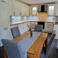 White kitchen with brown table
