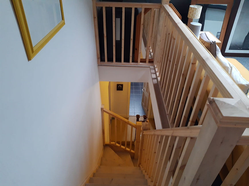 Large wooden stairs with spindles