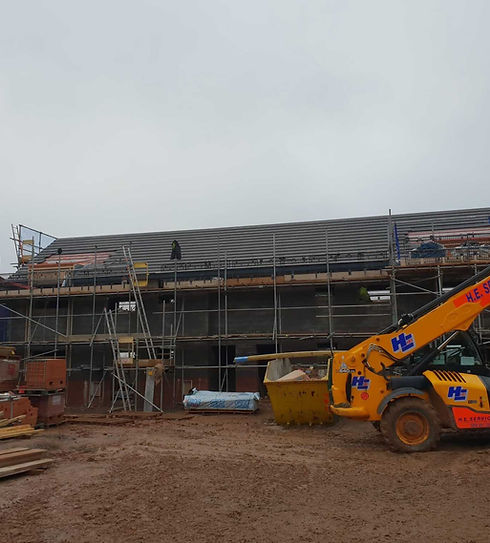 Home being constructed and work equipment being used