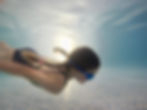 Swimming underwater at Knights Templar Swimming Pool in Watchet in West Somerset