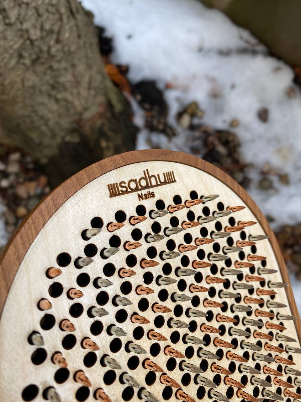 Thumbnail: Wooden board with metal nails