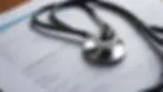 Close-up view of a stethoscope on a medical report
