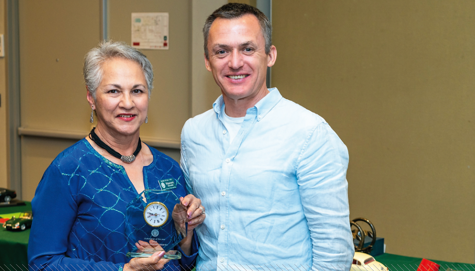 Mark Eedle, 2018 JLRA GM Brand Experience and Invictus Games Manager, presents Maureen the Clubwoman of the Year trophy | Photo: Rob Cranna