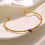 縮圖：Gold Cuff Bangle with Purple Gemstone Accent