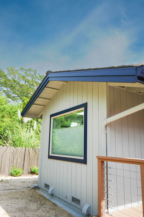 grey side of house with large window and blue trim in napa California 