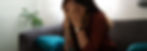 Overwhelmed woman in living room