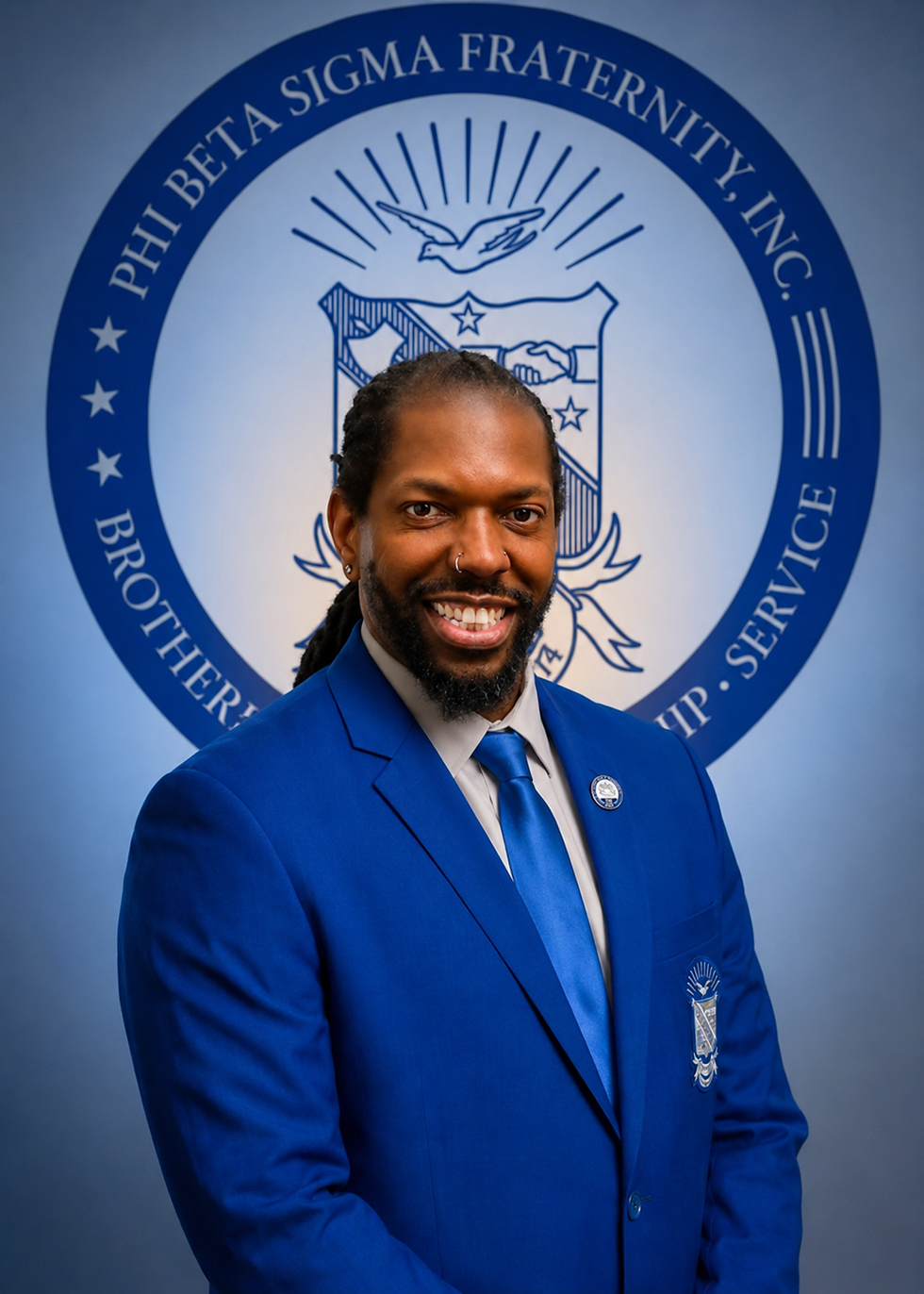 Smiling chapter leader in front of Phi Beta Sigma seal