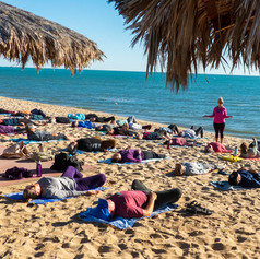 Yoga class on beach in Mexico