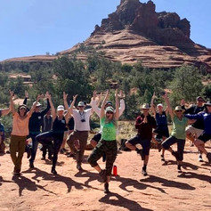 Yoga poses on the red rocks in Sedona AZ.
