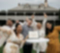 Wedding reception at Terrara House, Terrara NSW with Jo Booth Sydney marriage celebrant and MC. Bride and groom with two witnessing cheering with hands in the air in front of Terrara House.