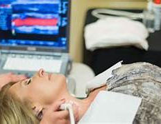 Ultrasound scan on patient's neck arteries
