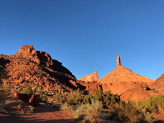 Rock climbers climbing in Kane Creek just outside of Moab Utah