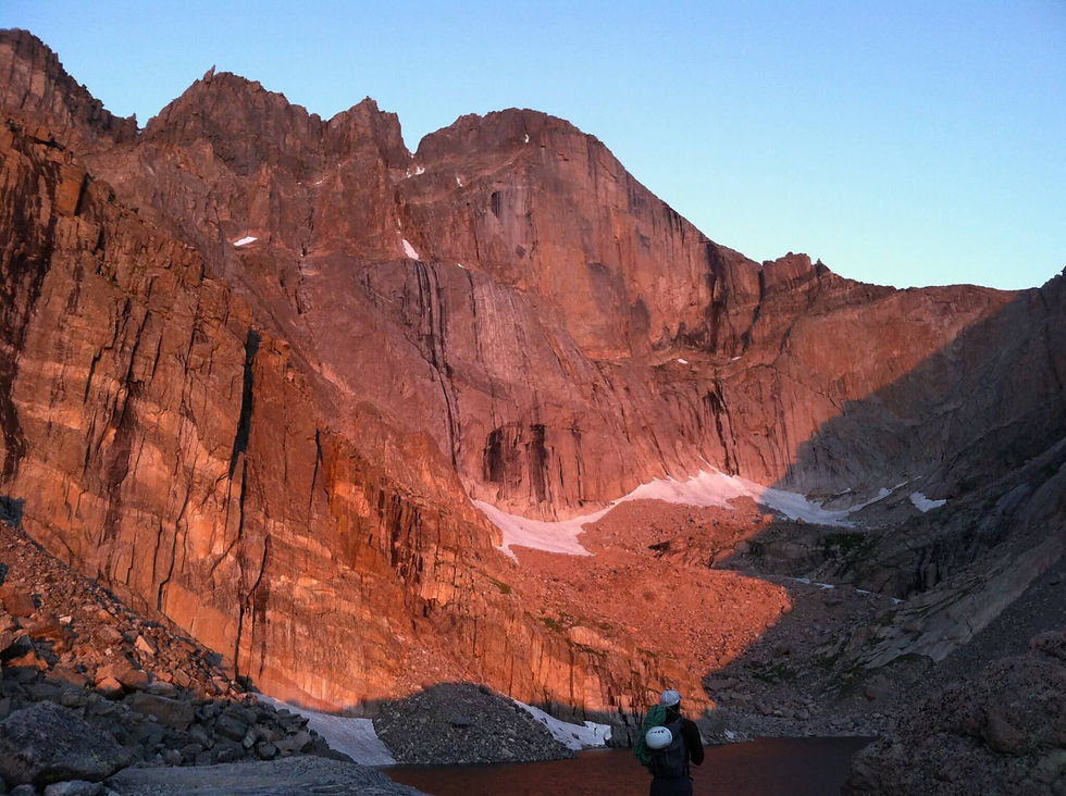 A climber looking at Longs Peak in Rocky Mountain National Park