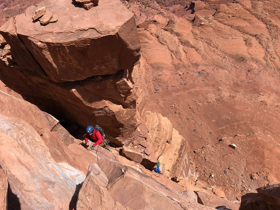 A climber on pitch three of the North Chimney - Castleton Tower
